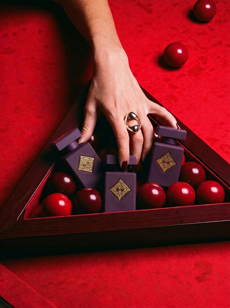 Perfume bottles racked among red billiard balls